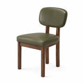 Silla de madera con asiento y respaldo de PU verde