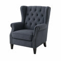 Sillón orejero tapizado en tejido gris oscuro