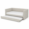 Cama nido tapizada en tela beige con colchón extraíble